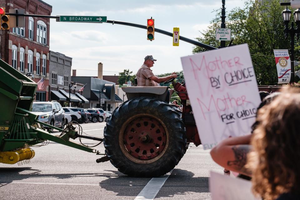 People protest the recent Supreme Court ruling that overturned Roe v. Wade outside the Tuscarawas County Courthouse in New Philadelphia on Wednesday.