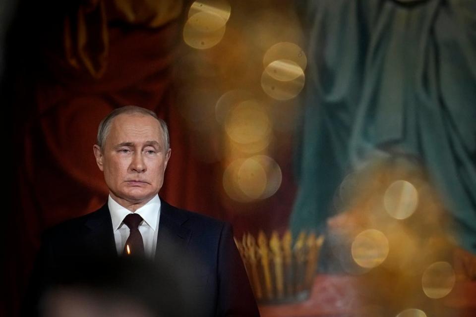 Russian President Vladimir Putin attends the Orthodox Easter service in the Christ the Savior Cathedral in Moscow, Russia, on 24 April (AP)