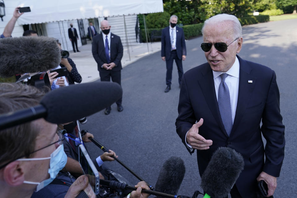 President Joe Biden talks with reporters before boarding Marine One on the South Lawn of the White House in Washington, Friday, July 30, 2021, as he heads Camp David for the weekend. (AP Photo/Susan Walsh)