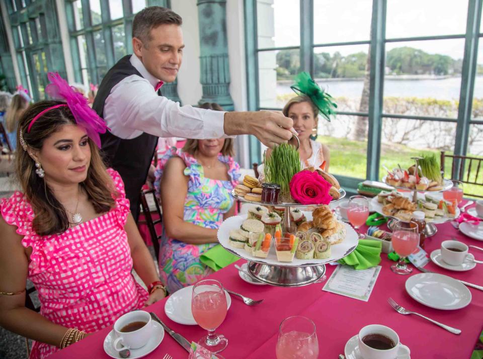 Women enjoy a tea service at the Henry Morrison Flagler Museum as part of The Pink Retreat on June 9, 2023, in Palm Beach.