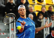 Italy's Andreas Seppi returns the ball to Britain's Andy Murray during their Davis Cup World Group quarterfinal match in Naples, Italy, Friday, April 4, 2014. (AP Photo/Salvatore Laporta)