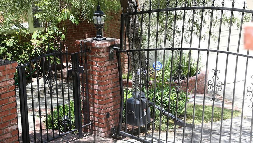 A photo of the crushed gate outside Anton's home. Source: Splash