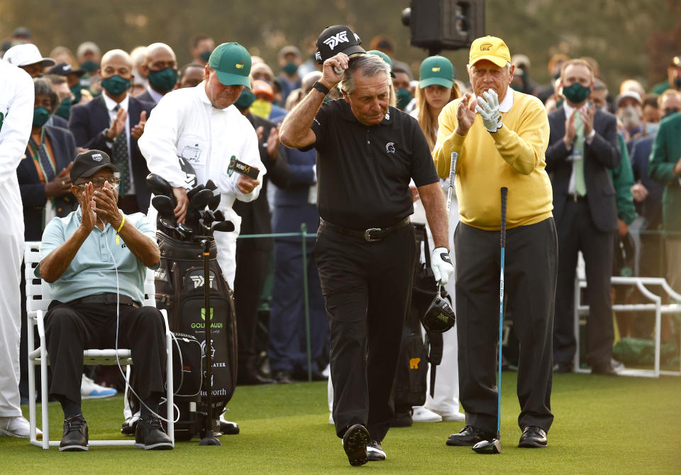 Wayne Player (second from left) holds a sleeve of golf balls directly behind Lee Elder (left). (Photo by Jared C. Tilton/Getty Images)