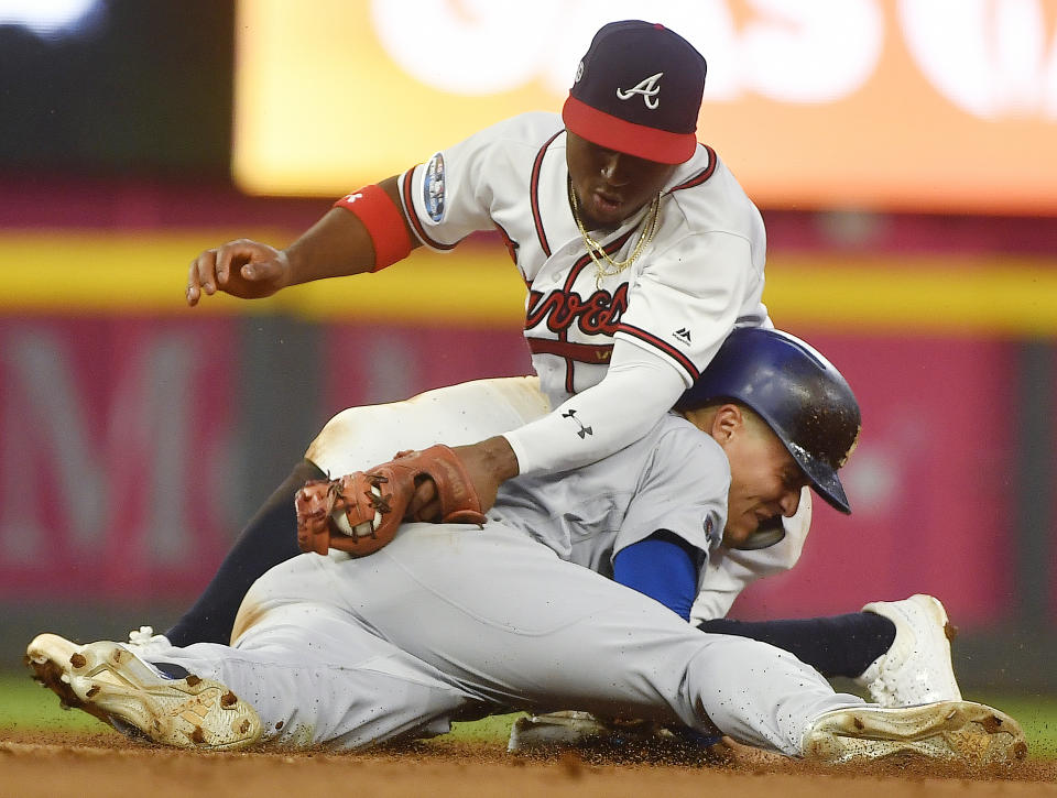 Los Angeles Dodgers' Enrique Hernandez (14) steals second base against Atlanta Braves second baseman Ozzie Albies (1) during the seventh inning in Game 4 of baseball's National League Division Series, Monday, Oct. 8, 2018, in Atlanta. (AP Photo/John Amis)