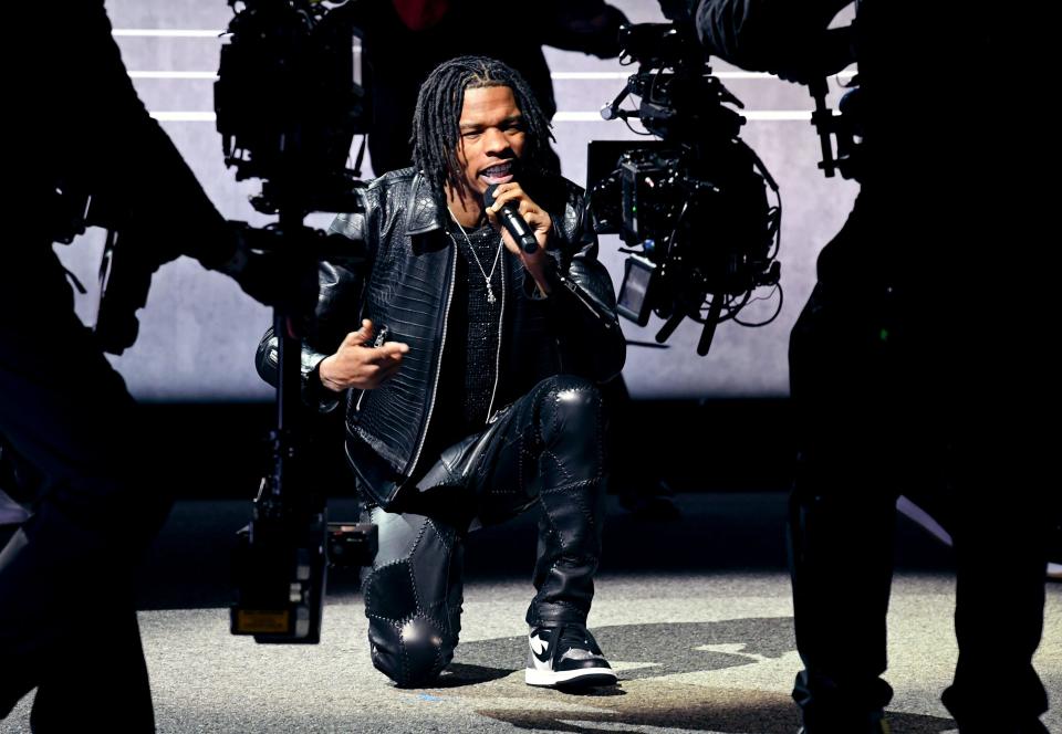 Lil Baby, shown here performing at the 2021 Grammy Awards, has turned a life of hardship and prison into chart-topping raps about the pitfalls and lessons of urban life. He's the focus of a new documentary produced by his label, "Untrapped," on Amazon Prime Video.