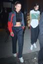 <p>In a cropped black hoodie, Vetements windbreaker, navy track pants, white sneakers and a Louis Vuitton backpack while out with Kendall Jenner in NYC.</p>