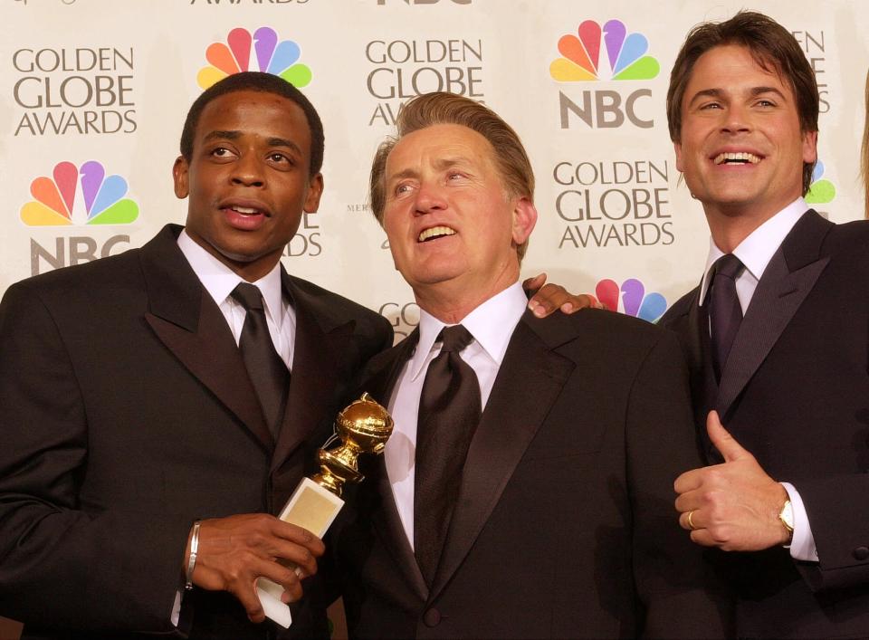 From left, Dule Hill, Martin Sheen and Rob Lowe display the best drama television series award won by "The West Wing" at the 58th Annual Golden Globe Awards in Beverly Hills, Calif., Sunday, Jan. 21, 2001. Sheen also won best actor in a dramatic television series for the same show. (AP Photo/Kevork Djansezian)