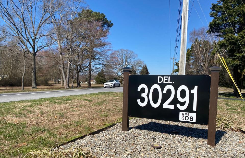 An address sign at the Morse home in Dagsboro was designed in the style of a low-digit black-and-white Delaware license plate.