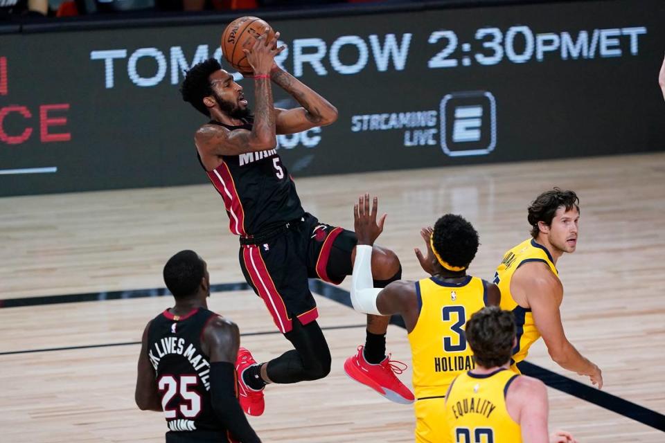 Heat wing Derrick Jones Jr. shoots against Indiana Pacers’ wing Aaron Holiday (No. 3) during an Aug. 14 game at the Disney complex.