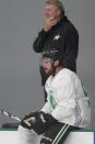 Dallas Stars head coach Rick Bowness, top, watches from the bench with center Tyler Seguin (91) during an NHL hockey practice in Frisco, Texas, Thursday, Sept. 23, 2021. (AP Photo/LM Otero)