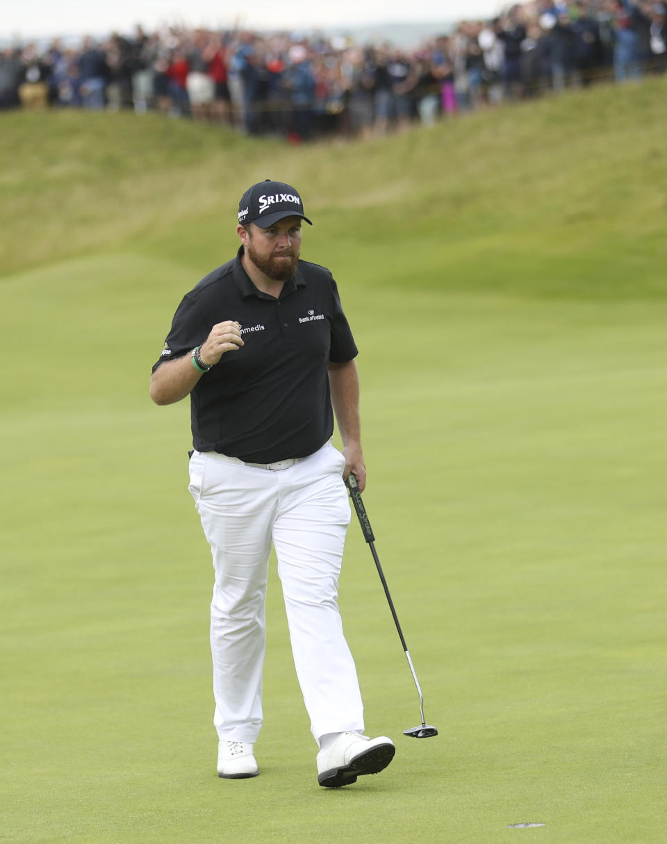 Ireland's Shane Lowry acknowledges the crowd after getting a birdie on the 16th green during the third round of the British Open Golf Championships at Royal Portrush in Northern Ireland, Saturday, July 20, 2019.(AP Photo/Peter Morrison)