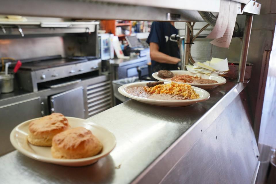 Cisco’s famous homemade biscuits, from left, migas plate, and huevos rancheros plate ready to be served sit at Cisco’s Restaurant Bakery and Bar in 2022.