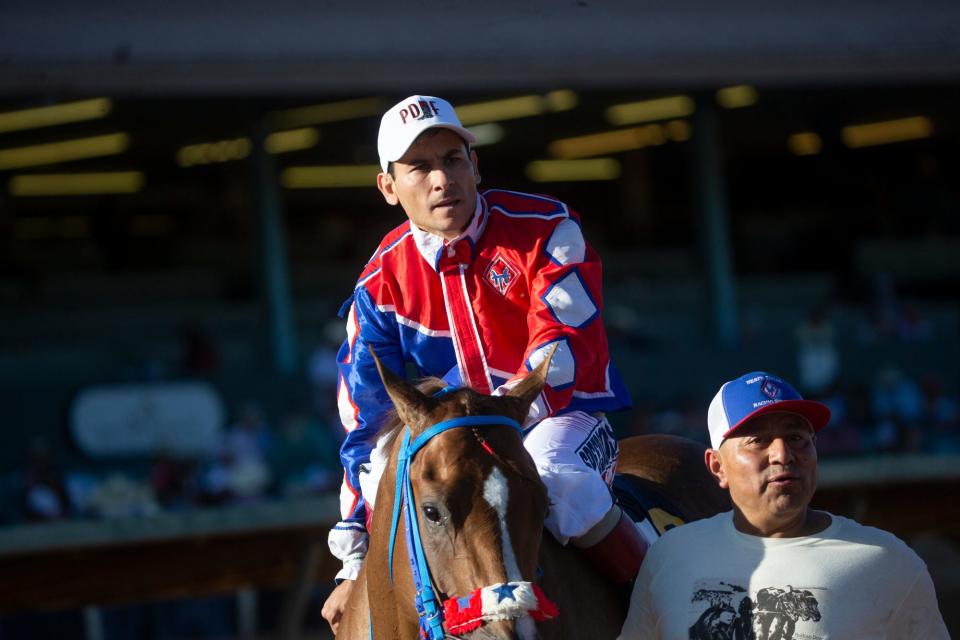 Jockey James A. Flores celebrates as his horse, Hes Judgeandjury wins the 2022 All American Futurity at the Ruidoso Downs Race Track and Casino on Labor Day  2022. 