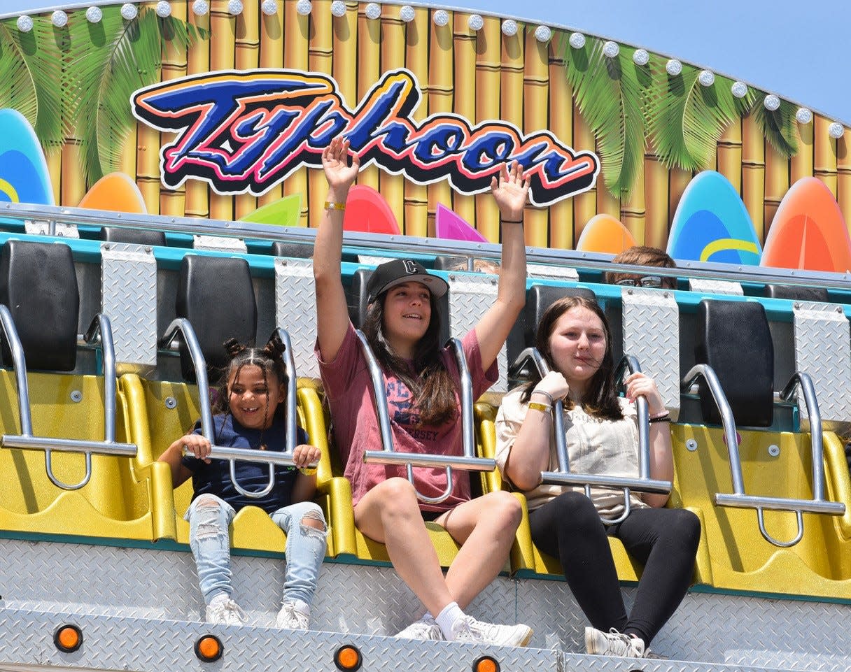 Five-year-old Averie Stokes, left, said the Typhoon was her favorite Walleye Festival ride.