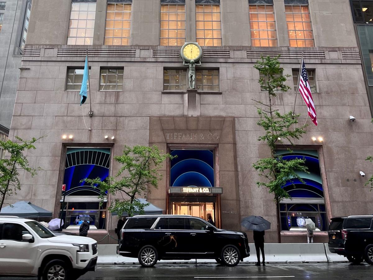 A shopper holds a bag from the Tiffany & Co. store on Fifth Avenue