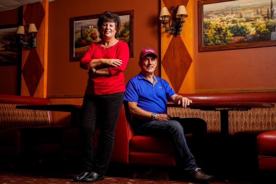 Owners Karen Ross and Mark Thomas pose for a portrait at the Tallyrand Restaurant in Burbank.