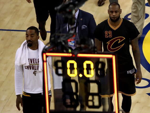 J.R. Smith and LeBron James walk off down 0-2. (Getty Images)