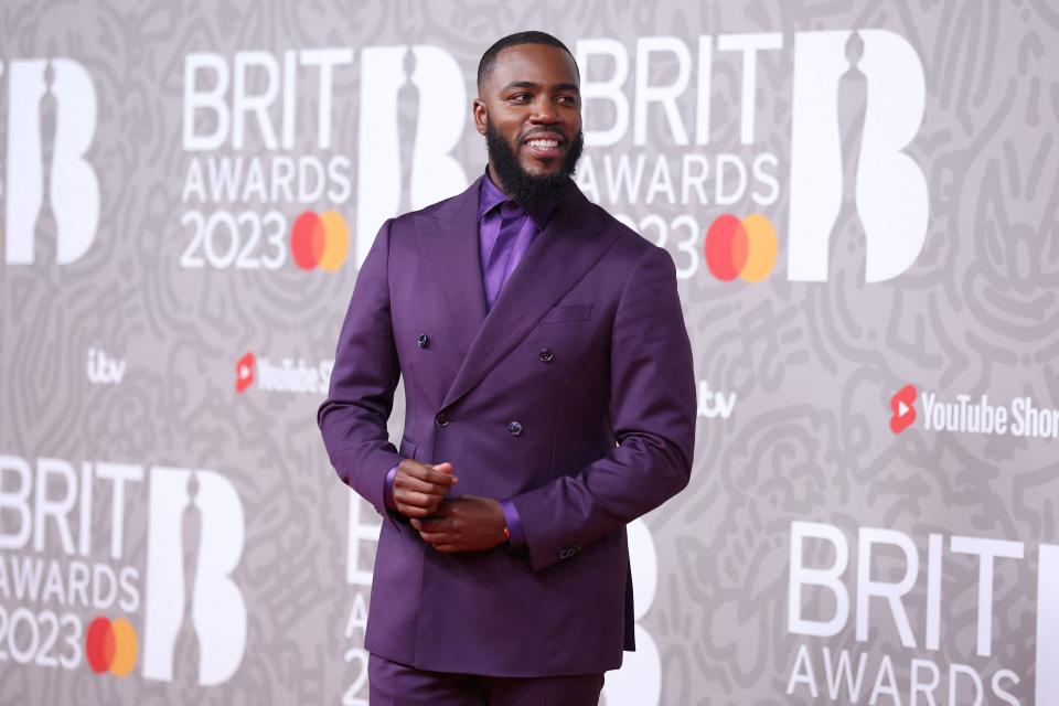 British comedian Mo Gilligan poses on the red carpet upon arrival for the BRIT Awards 2023 in London on February 11, 2023. - RESTRICTED TO EDITORIAL USE  NO POSTERS  NO MERCHANDISE NO USE IN PUBLICATIONS DEVOTED TO ARTISTS (Photo by ISABEL INFANTES / AFP) / RESTRICTED TO EDITORIAL USE  NO POSTERS  NO MERCHANDISE NO USE IN PUBLICATIONS DEVOTED TO ARTISTS (Photo by ISABEL INFANTES/AFP via Getty Images)