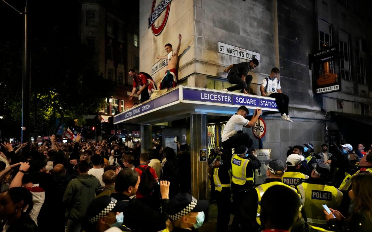 The scrapping of social distancing on July 19 could not come sooner for jubilant England fans as they celebrated the historic semi final win against Denmark - Matt Dunham/AP