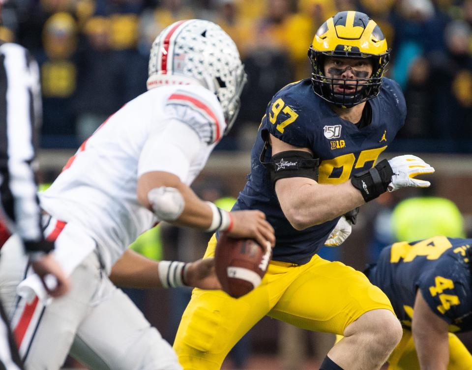 Michigan is hoping defensive end Aidan Hutchinson can disrupt Ohio State quarterback C.J. Stroud's passing ability.