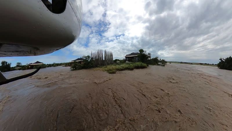 FILE PHOTO: A view from a helicopter shows safari lodges near the river within the flooded area following heavy rainfall in the Talek region, of the Maasai Mara