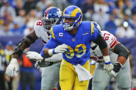 Los Angeles Rams' Aaron Donald looks for an opening during the first half of an NFL football game against the New York Giants, Sunday, Oct. 17, 2021, in East Rutherford, N.J. (AP Photo/John Munson)