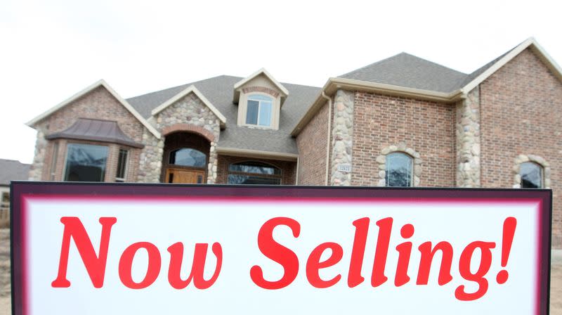 FILE PHOTO: A newly built home sits vacant with a "Now Selling" sign in front, in the Courtland Ridge development in Alpine, Utah