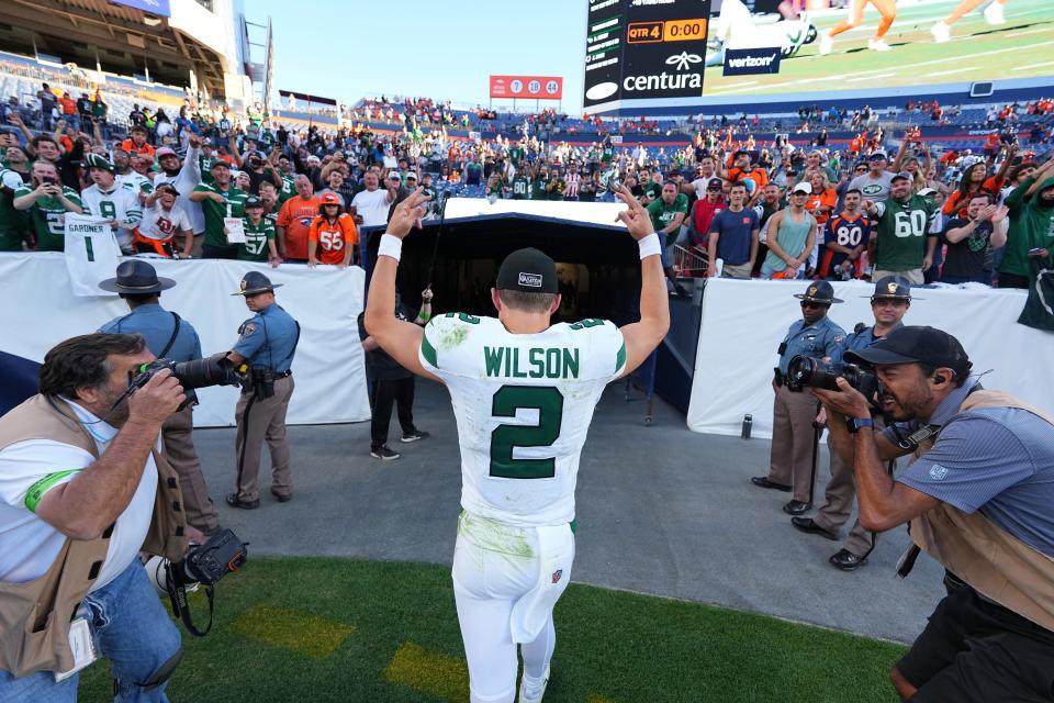 New York Jets quarterback Zach Wilson (2) celebrates the win post game against the Denver Broncos of an NFL football game Sunday October 8, 2023, in Denver. (AP Photo/Bart Young)