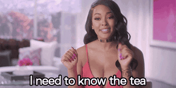 A gif of a woman saying "I need to know the tea"