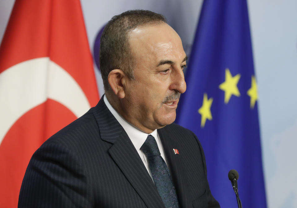 Turkey's Foreign Minister Mevlut Cavusoglu gives a joint statement with European Union foreign policy chief Josep Borrell prior to their meeting in Brussels, Thursday, Jan. 21, 2021. (Stephanie Lecocq/Pool Photo via AP)