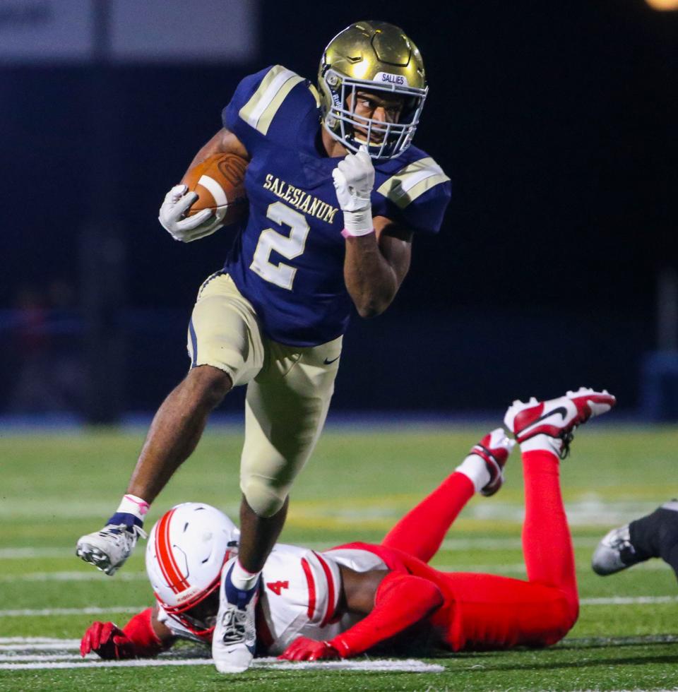 Salesianum's B.J. Alleyne gets in the open for a first quarter gain against Smyrna in Salesianum's 41-40 win in the first round of the DIAA Class 3A tournament, Friday, Nov. 17, 2023 at Abessinio Stadium.