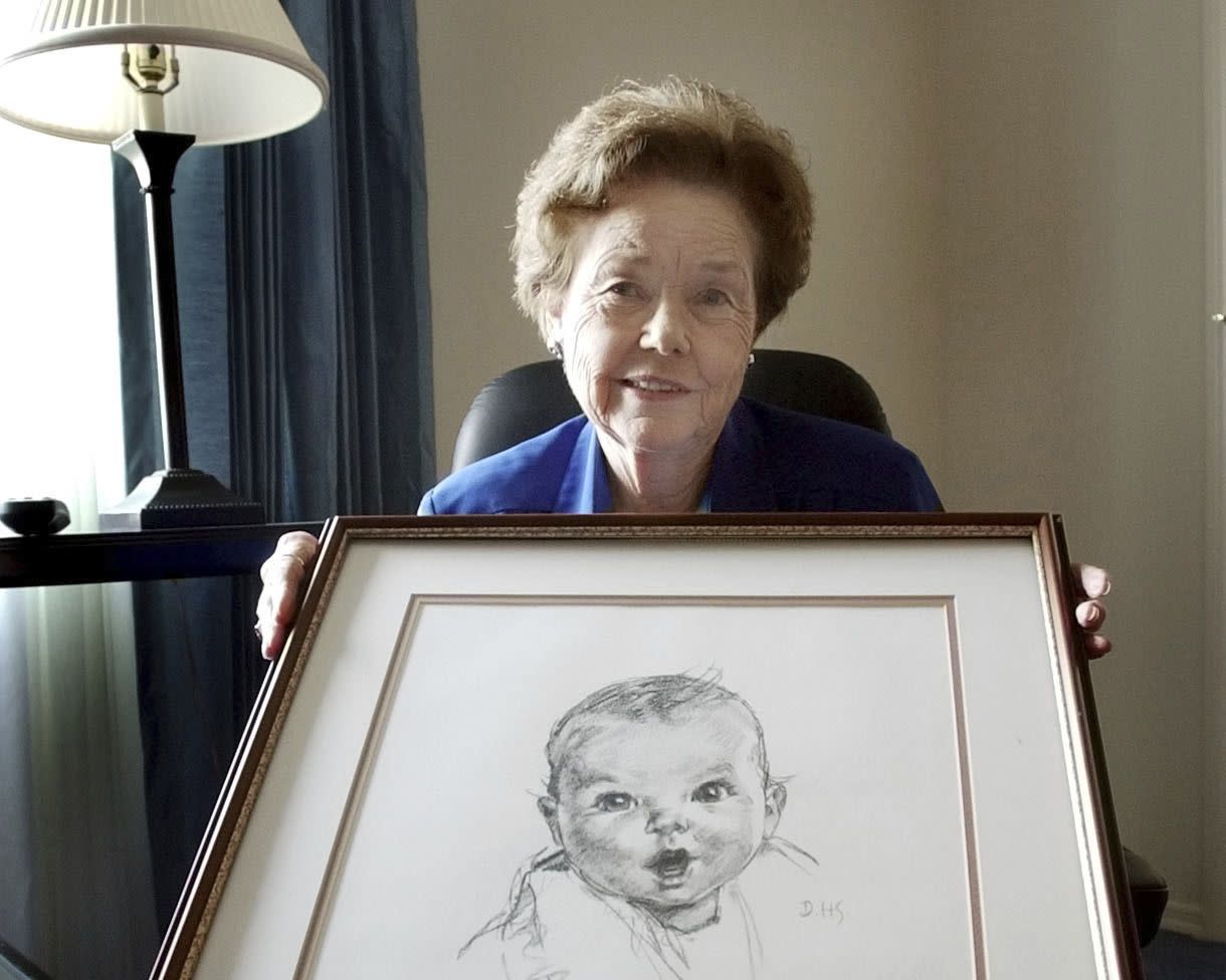 Ann Taylor Cook in her Tampa, Fla., home on Feb. 4, 2004, holding a copy of her photo that is used on all Gerber baby food products. 