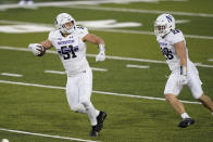 Northwestern linebacker Blake Gallagher (51) celebrates with teammate Chris Bergin, right, after intercepting a pass during the second half of an NCAA college football game against Iowa, Saturday, Oct. 31, 2020, in Iowa City, Iowa. (AP Photo/Charlie Neibergall)