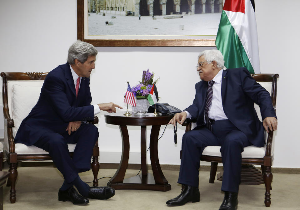 FILE - In this Dec. 5, 2013 file photo, U.S. Secretary of State John Kerry, left, meets Palestinian President Mahmoud Abbas in the West Bank city of Ramallah. Nine months of U.S.-driven diplomacy have left Israelis and Palestinians less hopeful than ever about a comprehensive peace agreement to end their century of conflict. Although a formula may yet be found to somehow prolong the talks past an end-of-April deadline, they are on the brink of collapse and the search is already on for new ideas. (AP Photo/Mohamad Torokman, Pool, File)