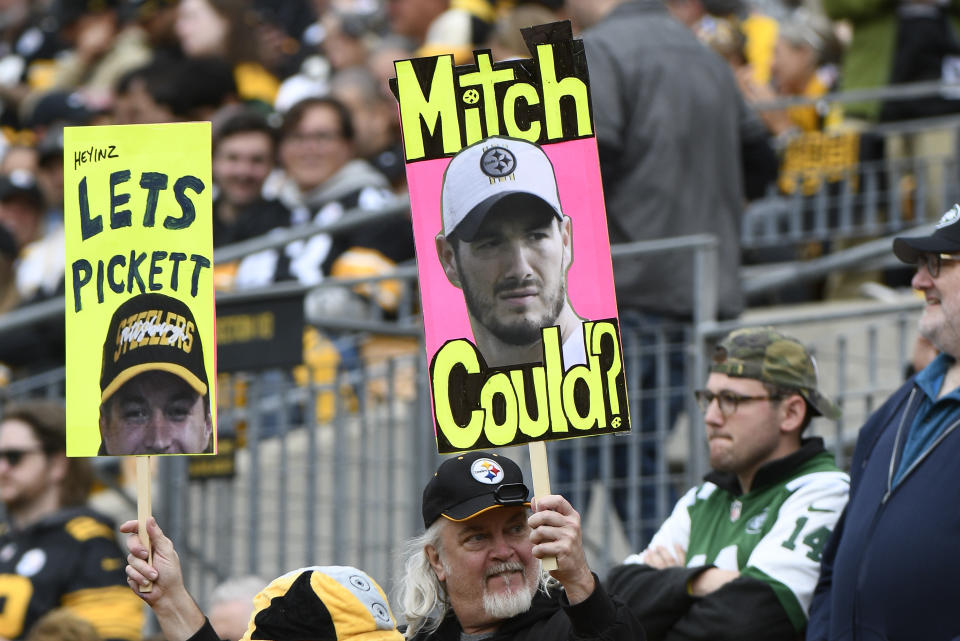 Pittsburgh Steelers fans hold signs during the first half of an NFL football game between the Steelers and the New York Jets, Sunday, Oct. 2, 2022, in Pittsburgh. (AP Photo/Don Wright)