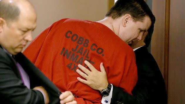 Justin Ross Harris, centre, talks with his lead attorney Maddox Kilgore at the conclusion of day two of a pre-trial motion hearing before Cobb County Superior Court Judge Mary Staley in Marietta. Photo: Kelly J. Huff/Marietta Daily Journal via AP