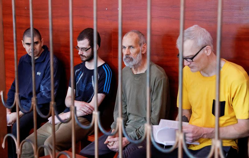 Foreign nationals captured during Ukraine-Russia conflict attend a court hearing in Donetsk