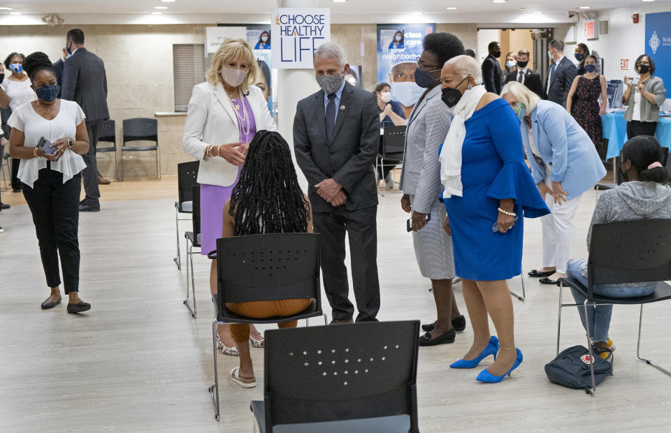 First lady Jill Biden, center left, and Dr. Anthony Fauci, director of the National Institute of Allergy and Infectious Diseases, speak to a person as they visit a vaccine clinic at the Abyssinian Baptist Church in the Harlem neighborhood of New York Sunday, June 6, 2021. (AP Photo/Craig Ruttle)