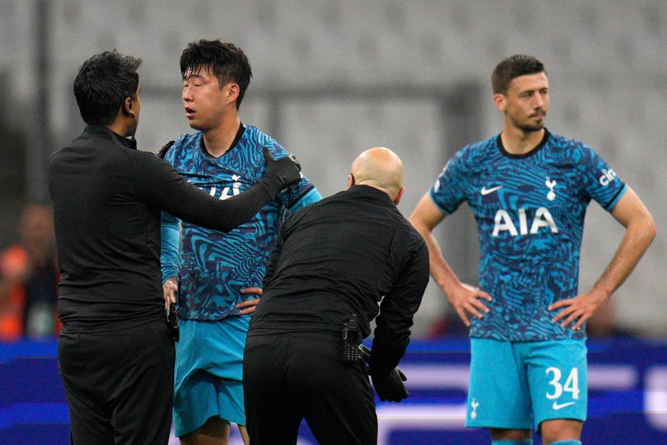 Tottenham's Son Heung-min receives treatment (AP)