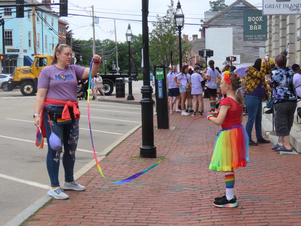 Mary Fudge of Exeter plays with her son Oscar, 8, before marching in the Portsmouth Pride Parade with the Seacoast Outright Little Outrighters on Saturday, June 22, 2024.