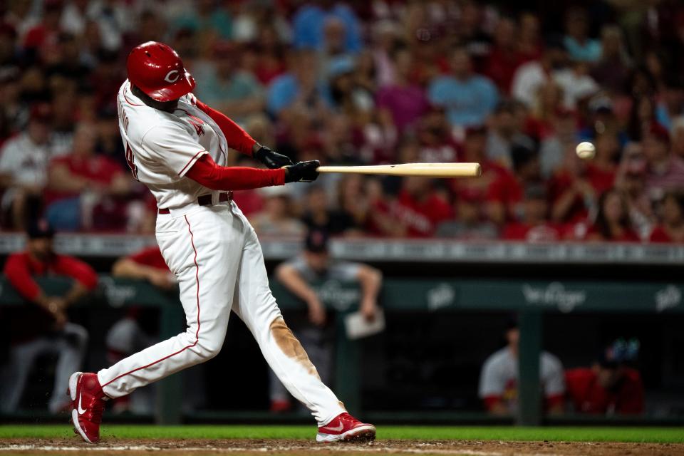 Cincinnati Reds right fielder Aristides Aquino (44) hits a base hit in the sixth inning of the MLB game between between the Cincinnati Reds and the St. Louis Cardinals at Great American Ball Park in Cincinnati, Wednesday, Aug. 31, 2022.