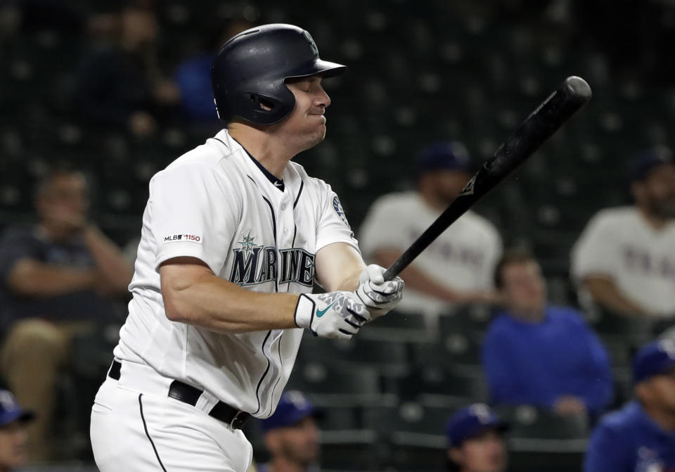 Seattle Mariners' Jay Bruce reacts after flying out against the Texas Rangers during the eighth inning of a baseball game, Tuesday, May 28, 2019, in Seattle. The Rangers won 11-4. (AP Photo/Ted S. Warren)