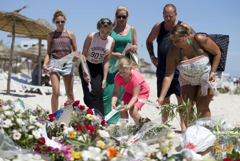 A British family, who witnessed the beach massacre by a jihadists gunman the previous week, lay flowers at the site of the attack in Port el Kantaoui, Tunisia, on June 30, 2015