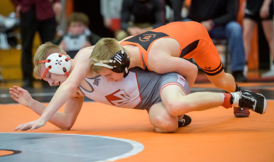 Washington's Noah Woods, top, and Morton's Caleb Lenning battle it out in the 113-pound match of the Class 2A wrestling regional Saturday, Feb. 4, 2023 at Washington Community High School. Woods won 22-8.