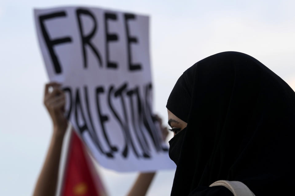 A woman from the Palestinian community takes part in a protest in support of the Palestinian people outside the National Museum in Brasilia, Brazil, Tuesday, Oct. 10, 2023. (AP Photo/Eraldo Peres, File)