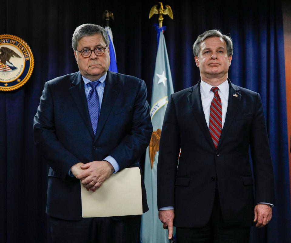 Attorney General William Barr and FBI Director Christopher Wray in Detroit on Dec. 18, 2019.