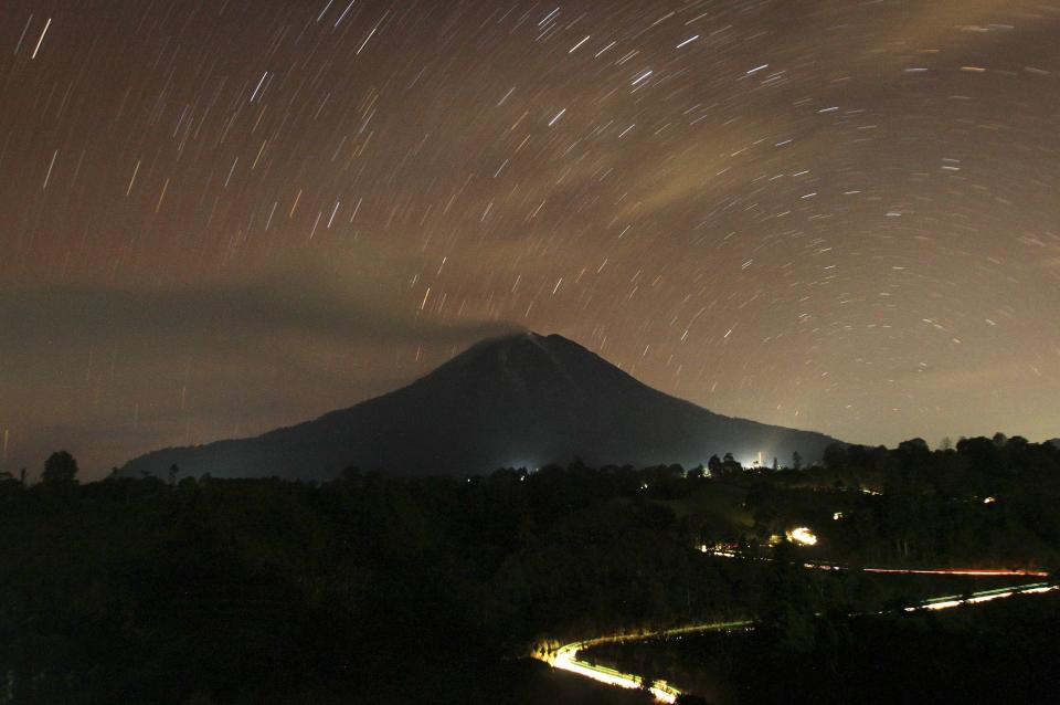 The starry night sky gives a sense of calm above Mount Sinabung. (Reuters)