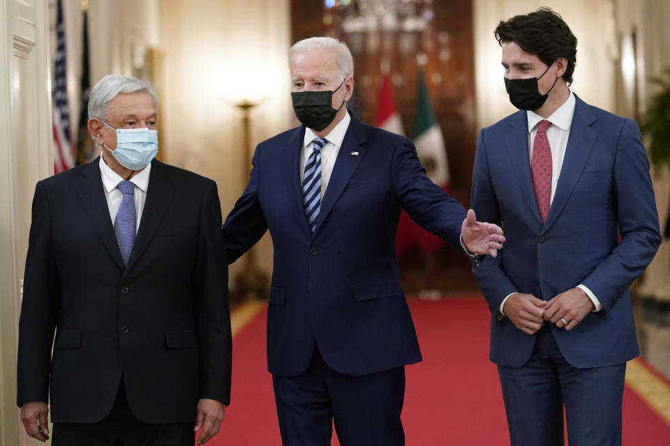 President Joe Biden walks with Mexican President Andrés Manuel López Obrador and Canadian Prime Minister Justin Trudeau during a meeting in the East Room of the White House in Washington, Thursday, Nov. 18, 2021. (AP Photo/Susan Walsh)