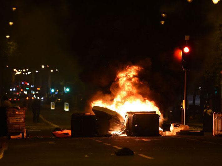 Makeshift road blocks were set on fire during protests over Rashan Charles and Edson Da Costa's deaths in Kingsland Road (PA)