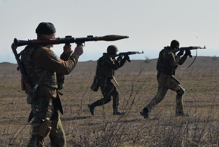 Fighters of Ukrainian volunteer Azov battalion take part in military exercises not far southeastern city of Mariupol, on February 27, 2015